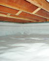 a moisture barrier installed on the walls and floors of a crawl space in Crested Butte