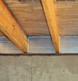 SilverGlo™ insulation installed in a floor joist in Eckert