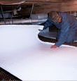 Palisade insulation being installed in a crawl space.