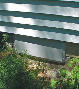 A gray crawl space vent cover in Crawford